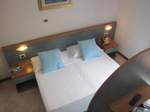 Postel nebo postele na pokoji v ubytování Residence Villa Margherita + 37 fotografií
