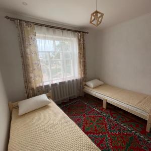 Postel nebo postele na pokoji v ubytování MAANAY Guest House