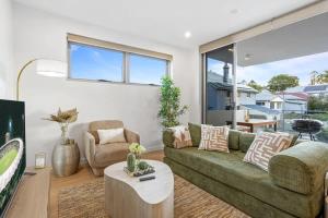 Posezení v ubytování Modern 2BR near The Gabba & BBQ