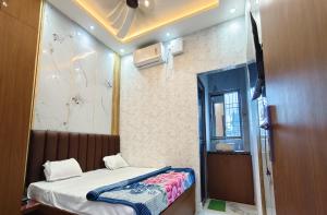 Postel nebo postele na pokoji v ubytování Radhika Resorts