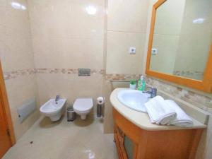 a bathroom with a sink and a toilet and a mirror at AlbufeiraOrada BlueSky by Be Cherish in Albufeira +35 photos