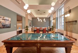 a pool table in the lobby of a building at DoubleTree By Hilton Trieste in Trieste