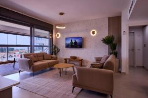 Μια τηλεόραση ή/και κέντρο ψυχαγωγίας στο AKAYA Luxury Apartment אכזיב