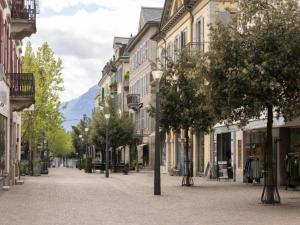 a street in a town with buildings and trees at Apartment in Veysonnaz near Ski Lift in Agettes