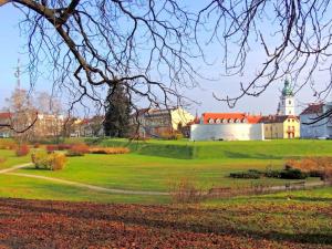 a park with a building in the middle of a field at Studio apartman IVAN in Karlovac