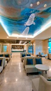 a waiting room with whales painted on the ceiling at Hi-YES Hotel Hualien in Hualien City