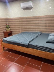 Postel nebo postele na pokoji v ubytování Homestay Sỏi Đá - Tây Ninh
