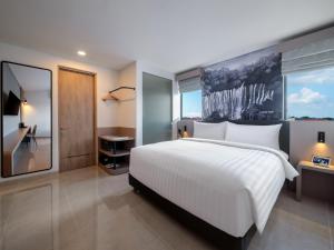 Cama o camas de una habitación en Aston Inn Lumajang - East Java