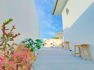 a view from the outside of a house with plants at Santra Pool Villa in Pattani