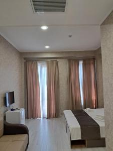 Postel nebo postele na pokoji v ubytování Astoria Hotel