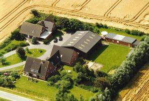 an aerial view of a house in a field at Ferienhof Kiesow in Nordstrand