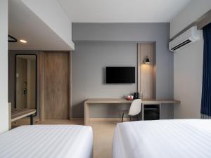 Cama o camas de una habitación en Aston Inn Lumajang - East Java
