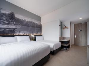Cama o camas de una habitación en Aston Inn Lumajang - East Java