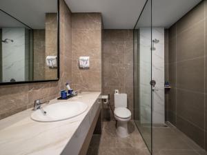 Un baño de Aston Inn Lumajang - East Java