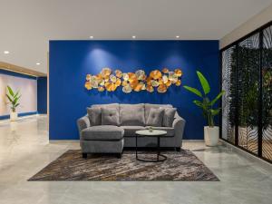 Zona de estar de Aston Inn Lumajang - East Java