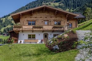 a wooden house on top of a hill at Waltenberghof in Kitzbühel