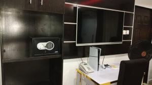 TV a/nebo společenská místnost v ubytování Dsign Apartment And Lounge