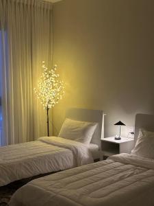 Postel nebo postele na pokoji v ubytování Boulevard Flat