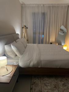 Postel nebo postele na pokoji v ubytování Boulevard Flat