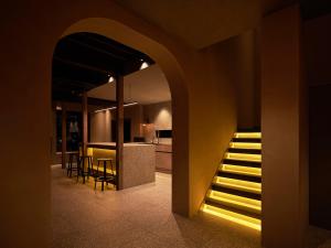 a staircase in a room with a kitchen and a house at N3 ATAMI-Forest- in Atami