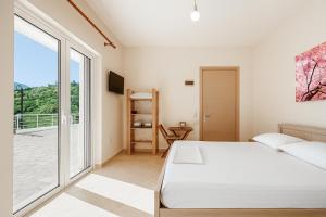 Ένα ή περισσότερα κρεβάτια σε δωμάτιο στο Bodini's Rooms