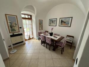 a dining room with a table and chairs at Cà Raffa - The Oasis of Peace in Ranzi