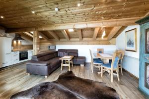 a living room with a couch and a table at Appartementanlage Kerber in Seefeld in Tirol +53 photos