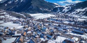 an aerial view of a town in the snow at Appart Tallas Pieds Des Pistes in Ancelle +2 photos
