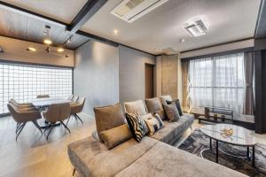 a living room with a couch and a table at Taiho Square 7th floor - Vacation STAY 19139 in Osaka