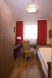 מיטה או מיטות בחדר ב-Hotel Kirchbichl
