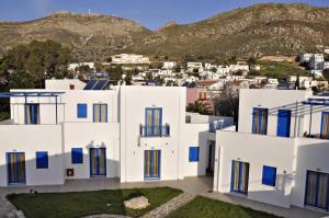 a view of a white building with blue windows at Ellibay in Livadia