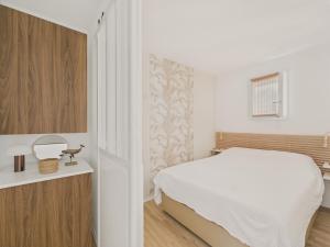 Postel nebo postele na pokoji v ubytování Face à l'océan - Appart pour 4 avec balcon