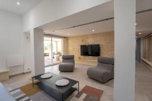Μια τηλεόραση ή/και κέντρο ψυχαγωγίας στο Résidence Coliving Bordeaux : Chambres Privées Tout Inclus
