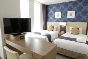 Postel nebo postele na pokoji v ubytování Mercure Yokosuka