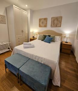 En eller flere senge i et værelse på Casa Entre Viñas, jardin privado con piscina comunitaria