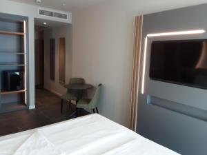 Postel nebo postele na pokoji v ubytování HOTEL ASTOR