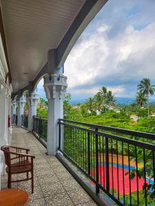 a balcony of a building with a view of the ocean at Chevilly Resort & Camp in Bogor