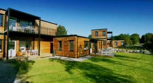 a large house with a yard with a patio at Atlanten Turistsenter in Kristiansund