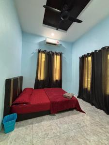 Voodi või voodid majutusasutuse Siti Homestay Unit 2 Langkawi toas
