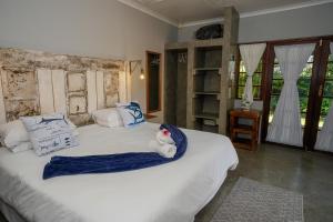 Ένα ή περισσότερα κρεβάτια σε δωμάτιο στο Marlin Lodge St Lucia