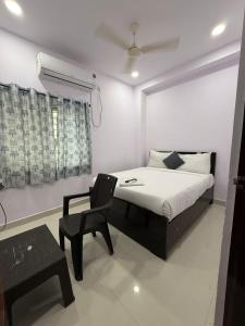 Ένα ή περισσότερα κρεβάτια σε δωμάτιο στο Hotel Udaan Villa