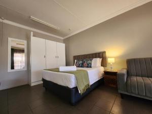 Ένα ή περισσότερα κρεβάτια σε δωμάτιο στο Tree Orchid