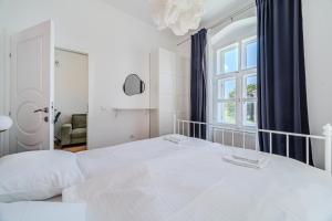 Katil atau katil-katil dalam bilik di Old Town Heritage Apartments
