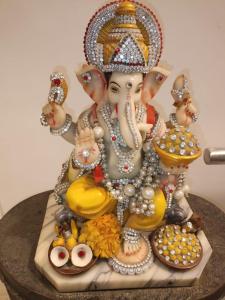 a statue of a woman holding a bowl of food at Anant in Jāmb