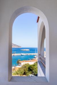a view of the ocean from a window at Oceanis Hotel in Karpathos