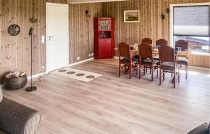 a dining room with a table and chairs at Beautiful Home In Åmli With House A Mountain View in Åmli