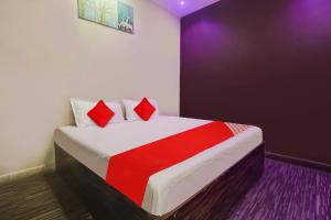 Postel nebo postele na pokoji v ubytování Hotel O Delight Inn