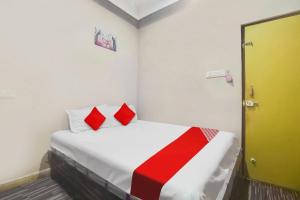 Postel nebo postele na pokoji v ubytování Hotel O Delight Inn