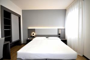 Postel nebo postele na pokoji v ubytování Hotel Igea
