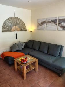 a living room with a couch and a table at Schwalbenweg in Zingst